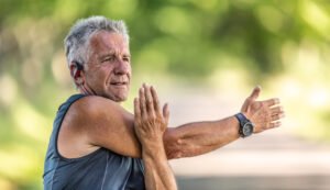 vecteezy elderly fit man stretches his arm on a summer day outdoors 27485587