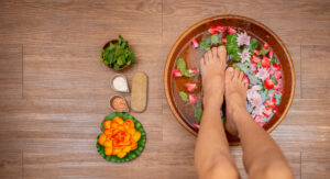 vecteezy woman soaks her feet in a bowl with flower petals 25880050